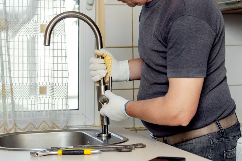 Handyman fixing a kitchen sink