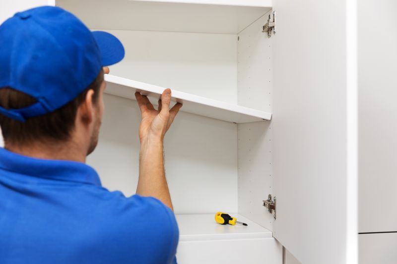 Handyman installing shelves